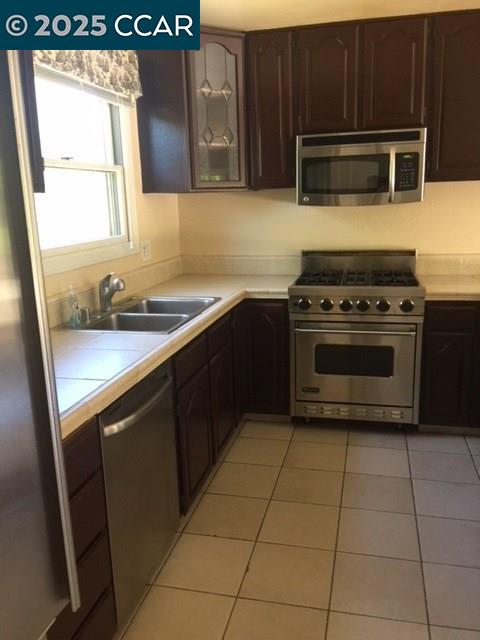 1000 Sanders Drive Moraga, CA 94556 - Photo 17 of 32 a kitchen with a stove and a microwave