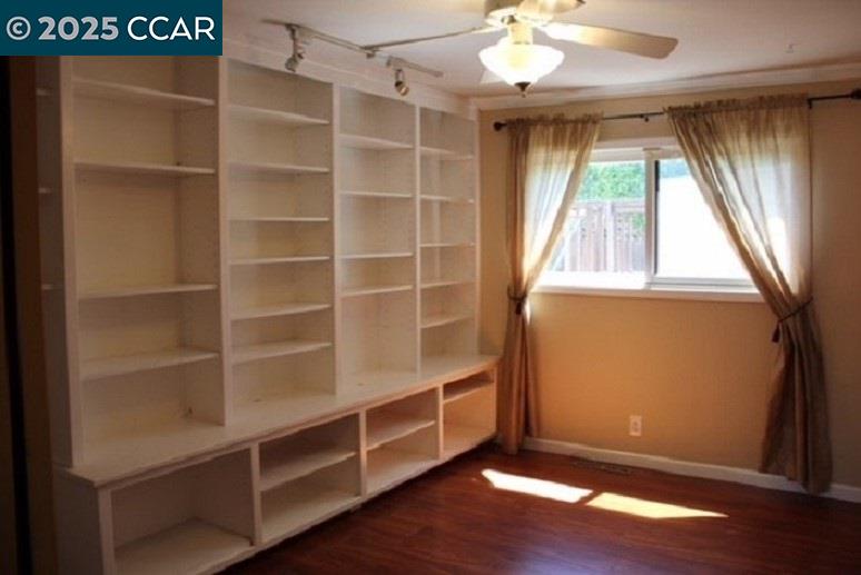 1000 Sanders Drive Moraga, CA 94556 - Photo 19 of 32 a view of an empty room with a window and wooden floor