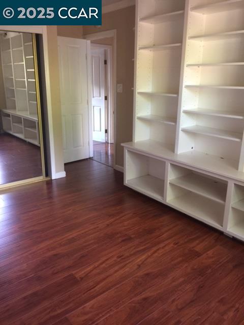 1000 Sanders Drive Moraga, CA 94556 - Photo 20 of 32 a view of an empty room with wooden floor and a window
