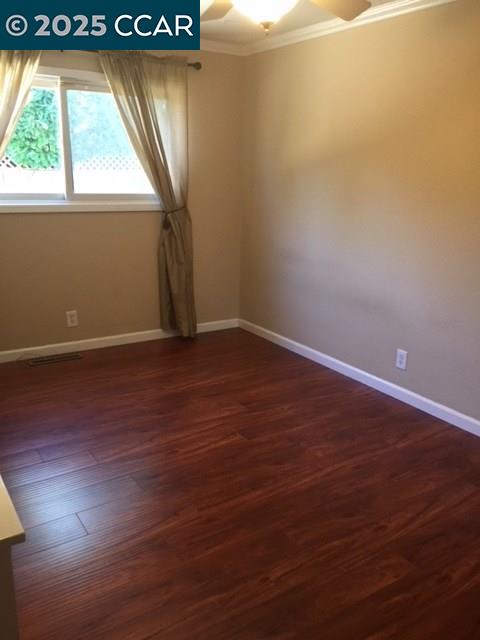 1000 Sanders Drive Moraga, CA 94556 - Photo 21 of 32 an empty room with wooden floor and windows