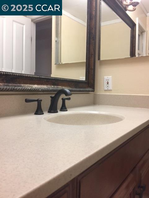 1000 Sanders Drive Moraga, CA 94556 - Photo 24 of 32 a bathroom with a sink and a mirror