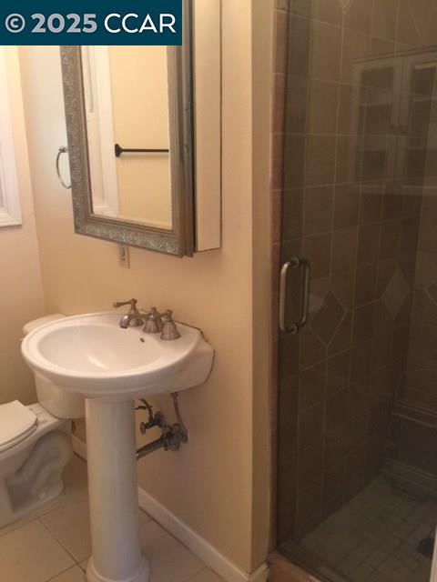 1000 Sanders Drive Moraga, CA 94556 - Photo 29 of 32 a bathroom with a sink a mirror and a shower