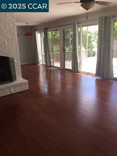 1000 Sanders Drive Moraga, CA 94556 - Photo 9 of 32 a view of an empty room with wooden floor and a window