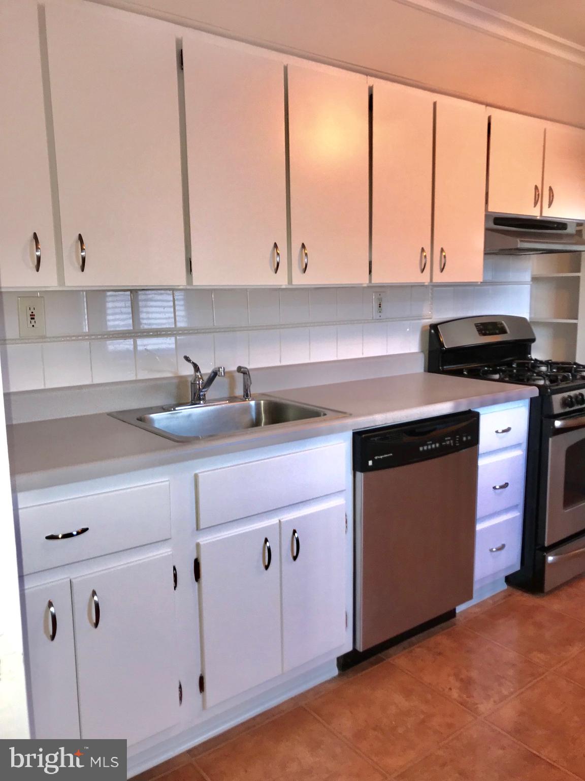 7607 Spruce Road Baltimore, MD 21222 - Photo 6 of 23 Kitchen with stainless appliances
