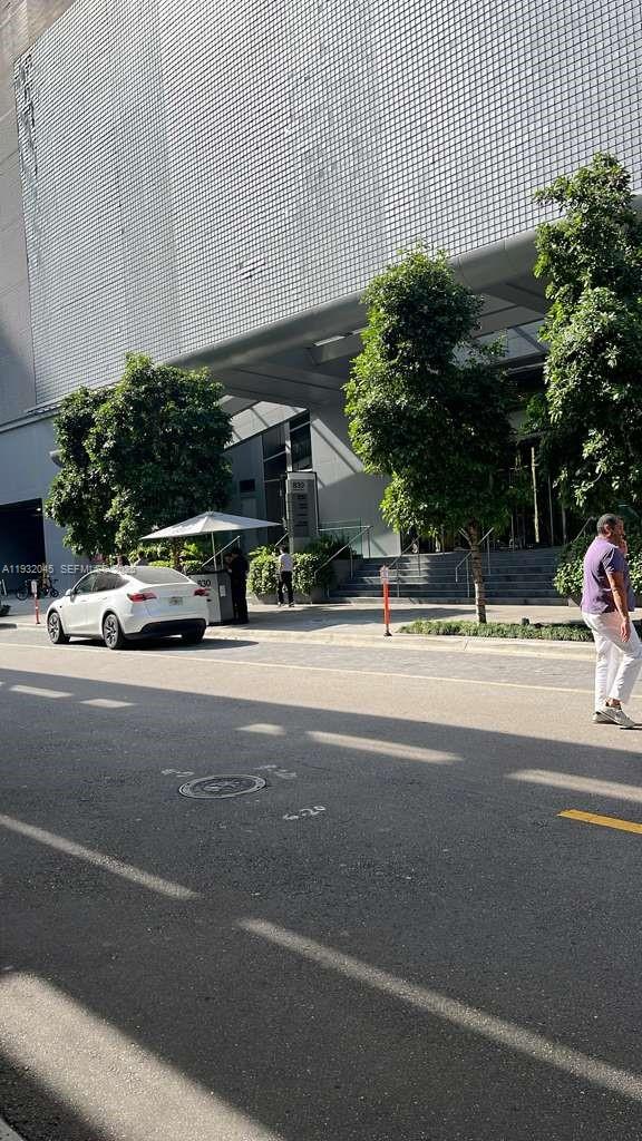 a view of street with parked cars