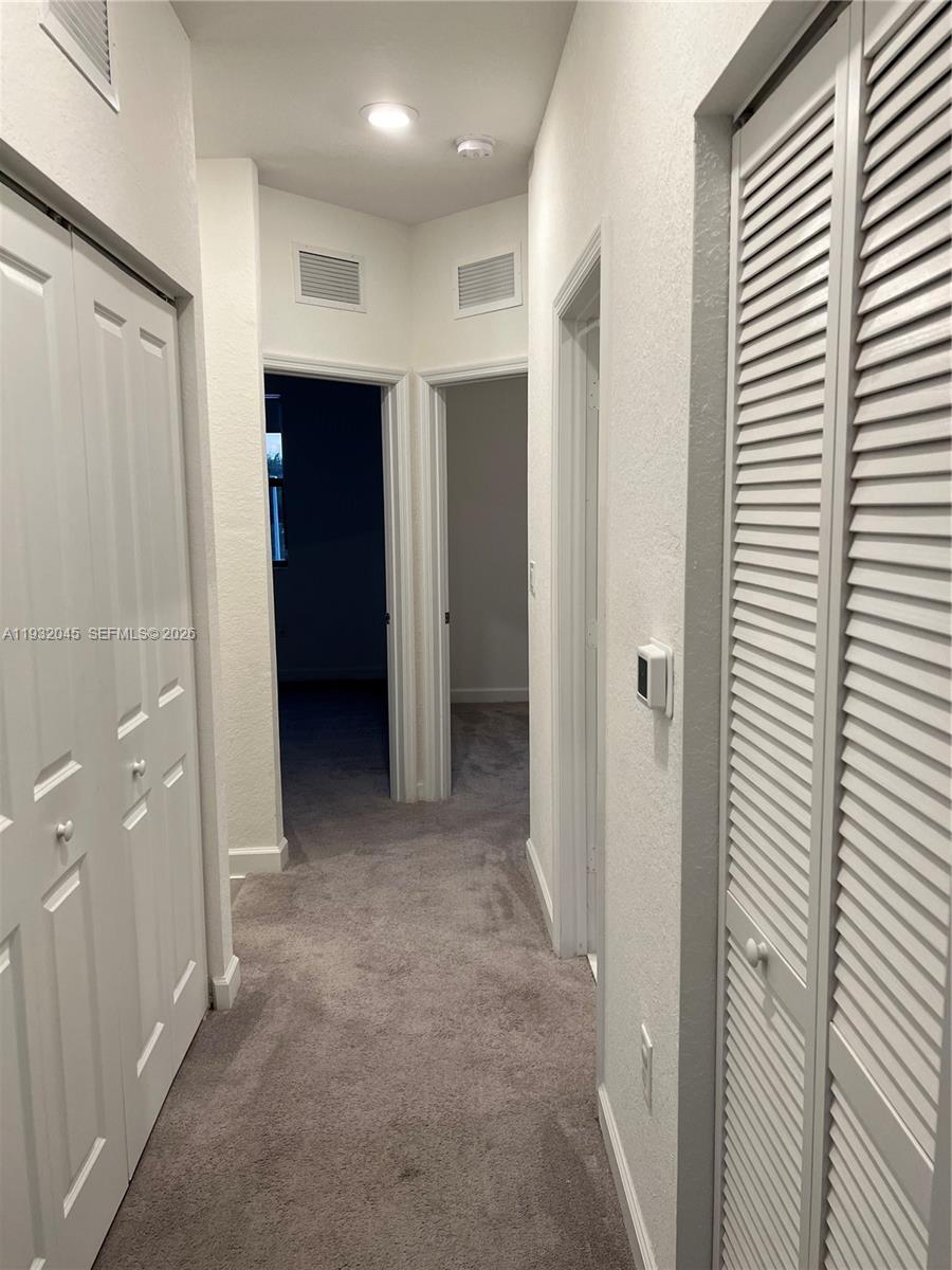 13387 Southwest 287th Terrace Homestead, FL 33033 - Photo 14 of 50 a view of hallway with closet area