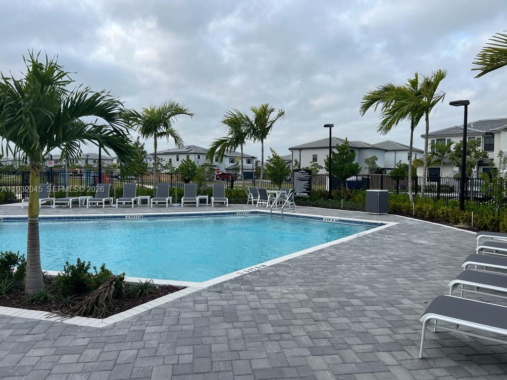 13387 Southwest 287th Terrace Homestead, FL 33033 - Photo 20 of 50 a view of swimming pool with outdoor seating and plants