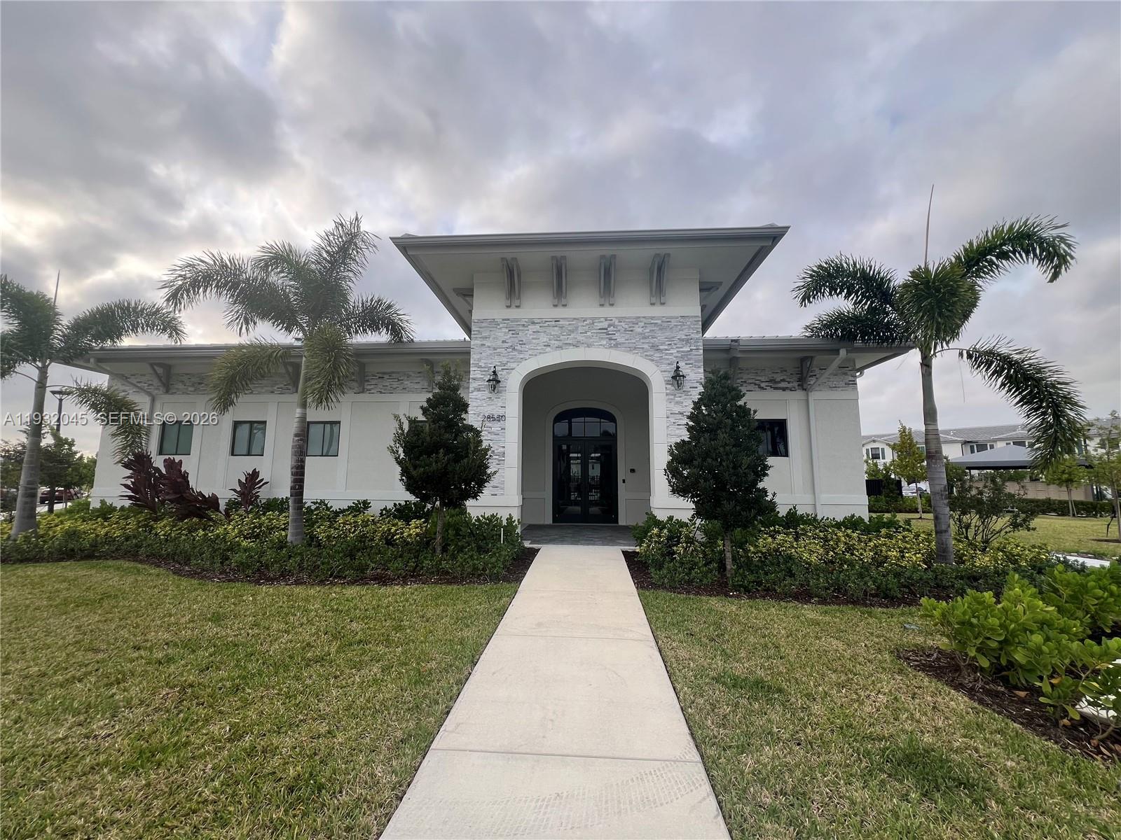 13387 Southwest 287th Terrace Homestead, FL 33033 - Photo 23 of 50 a front view of a house with garden