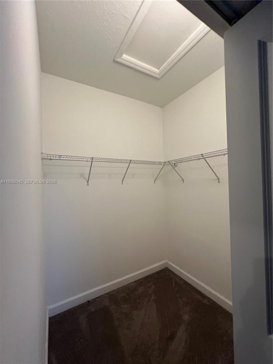 13387 Southwest 287th Terrace Homestead, FL 33033 - Photo 30 of 50 a view of a room with racks on the wall