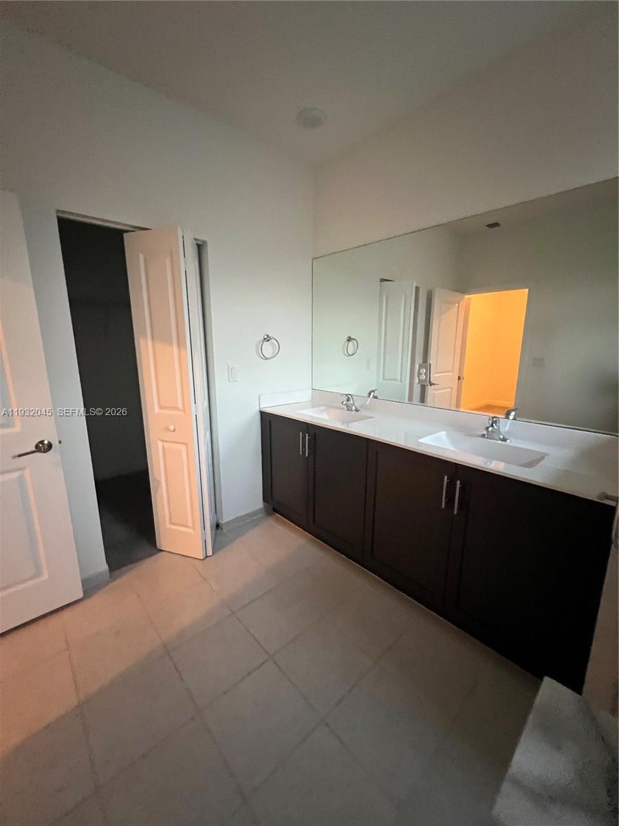 13387 Southwest 287th Terrace Homestead, FL 33033 - Photo 32 of 50 a room with a sink and a mirror