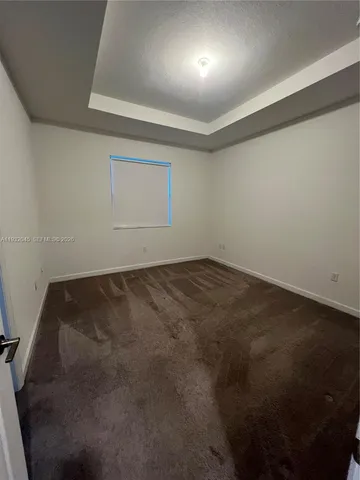 an empty room with a empty space and windows