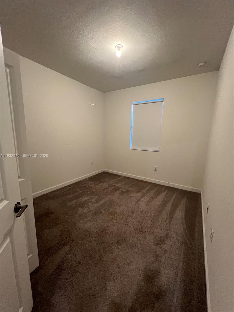 13387 Southwest 287th Terrace Homestead, FL 33033 - Photo 39 of 50 an empty room with a window