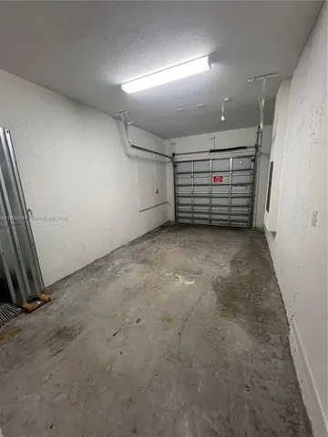 an empty room with white walls