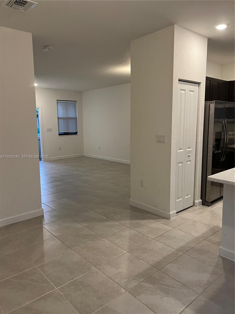13387 Southwest 287th Terrace Homestead, FL 33033 - Photo 6 of 50 a view of a hallway with wooden shelves