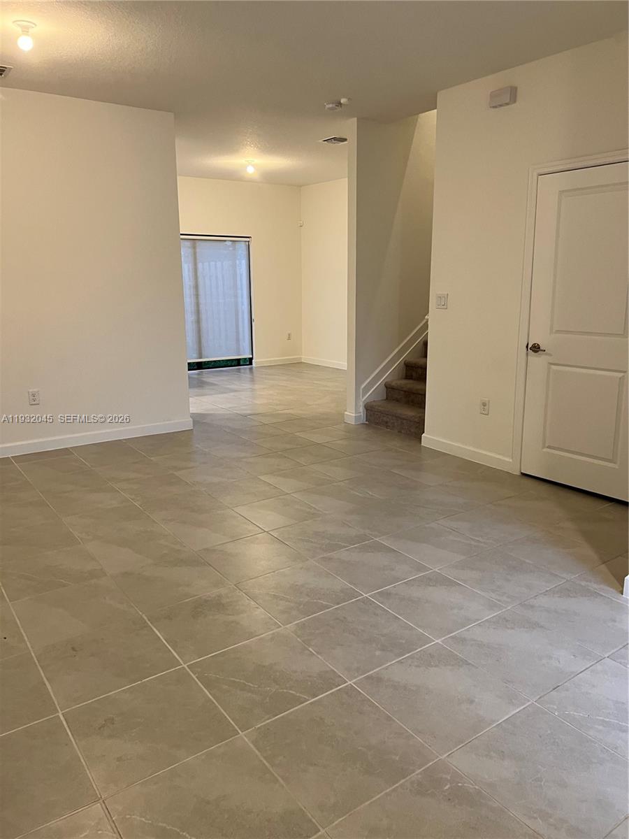 13387 Southwest 287th Terrace Homestead, FL 33033 - Photo 7 of 50 an empty room with a empty space and windows