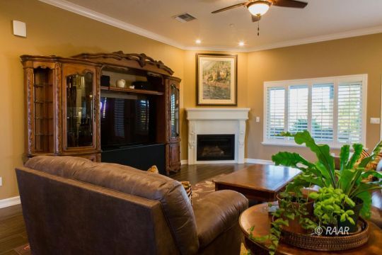 430 West Javis Avenue Ridgecrest, CA 93555 - Photo 7 of 35 a living room with furniture and a fireplace