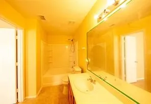 a spacious bathroom with a tub and shower