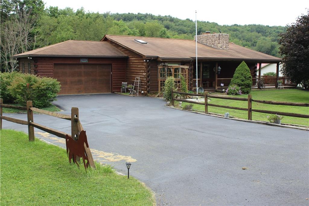 190 Leslie Road Valencia, PA 16059 - Photo 1 of 25 Minutes to Rtes 8, 228, 19, I76 & I79, MARS SCHOOL DISTRICT, BUTLER COUNTY, this CEDAR LOG HOME sits on 3+ acres of gorgeous lawns & woodlands. One-Level Living w/ 2 bedrooms & bathrooms on the Main Floor, OPEN FLOOR CONCEPT & more.