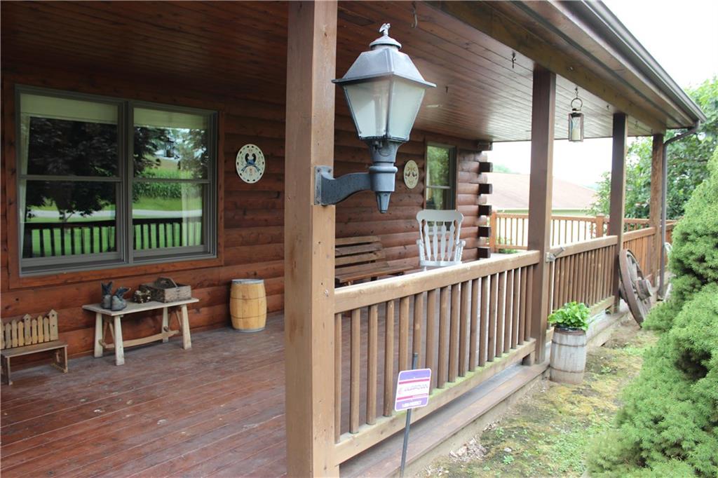 190 Leslie Road Valencia, PA 16059 - Photo 2 of 25 Covered front porch wraps around to the open & covered rear deck that overlooks a grand back yard view that goes into a true country tree line.
