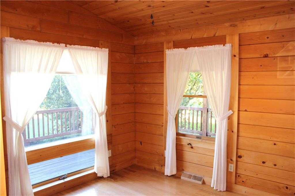 190 Leslie Road Valencia, PA 16059 - Photo 20 of 25 Main floor bedroom #2 view. Large feature windows overlooks wraparound deck and spacious side lawns. So cheery!