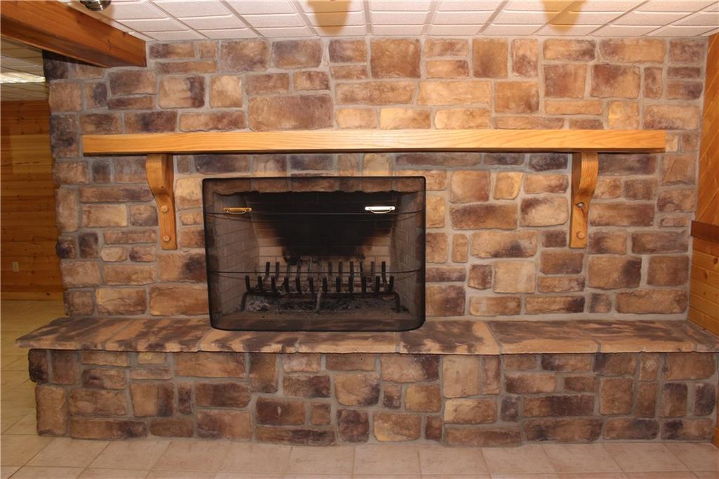 190 Leslie Road Valencia, PA 16059 - Photo 22 of 25 Lower level wood-burning stone fireplace has a 48" opening (same as main floor fireplace) and hefty oak mantle.