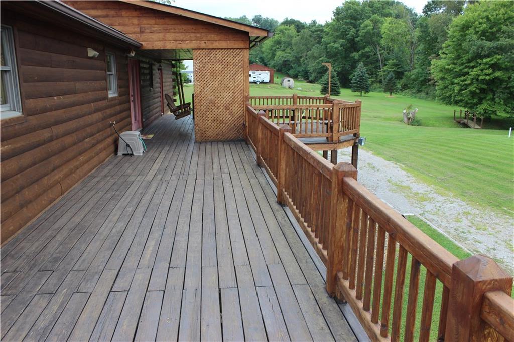 190 Leslie Road Valencia, PA 16059 - Photo 5 of 25 The rear covered porch area, which is accessed from the Main Floor Kitchen area, features a hanging country swing, built-in BBQ grill, stationary benche, a bump-out deck area and a GRAND VIEW.