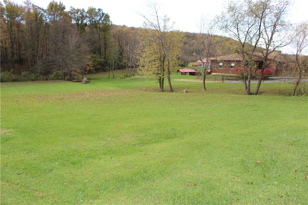 190 Leslie Road Valencia, PA 16059 - Photo 8 of 25 This is property view shows the spaciousness of the land that surrounds the lefthand side of the home.