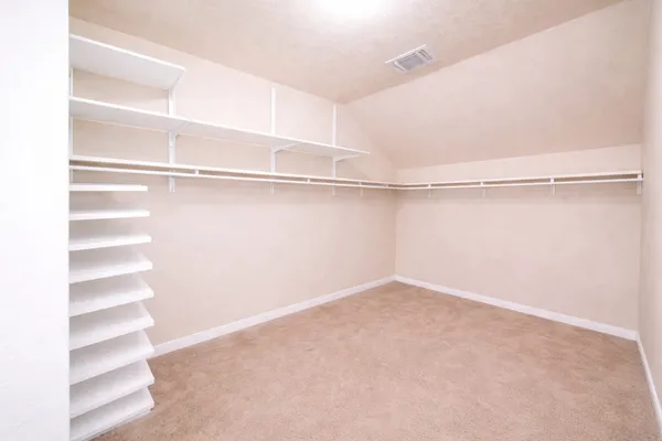 a view of an empty walk in closet
