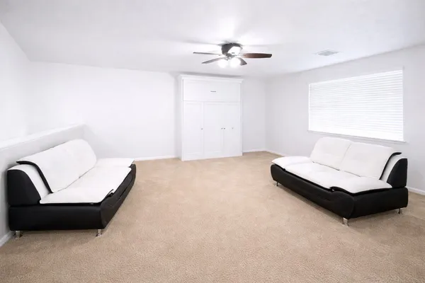 a living room with furniture and a couch