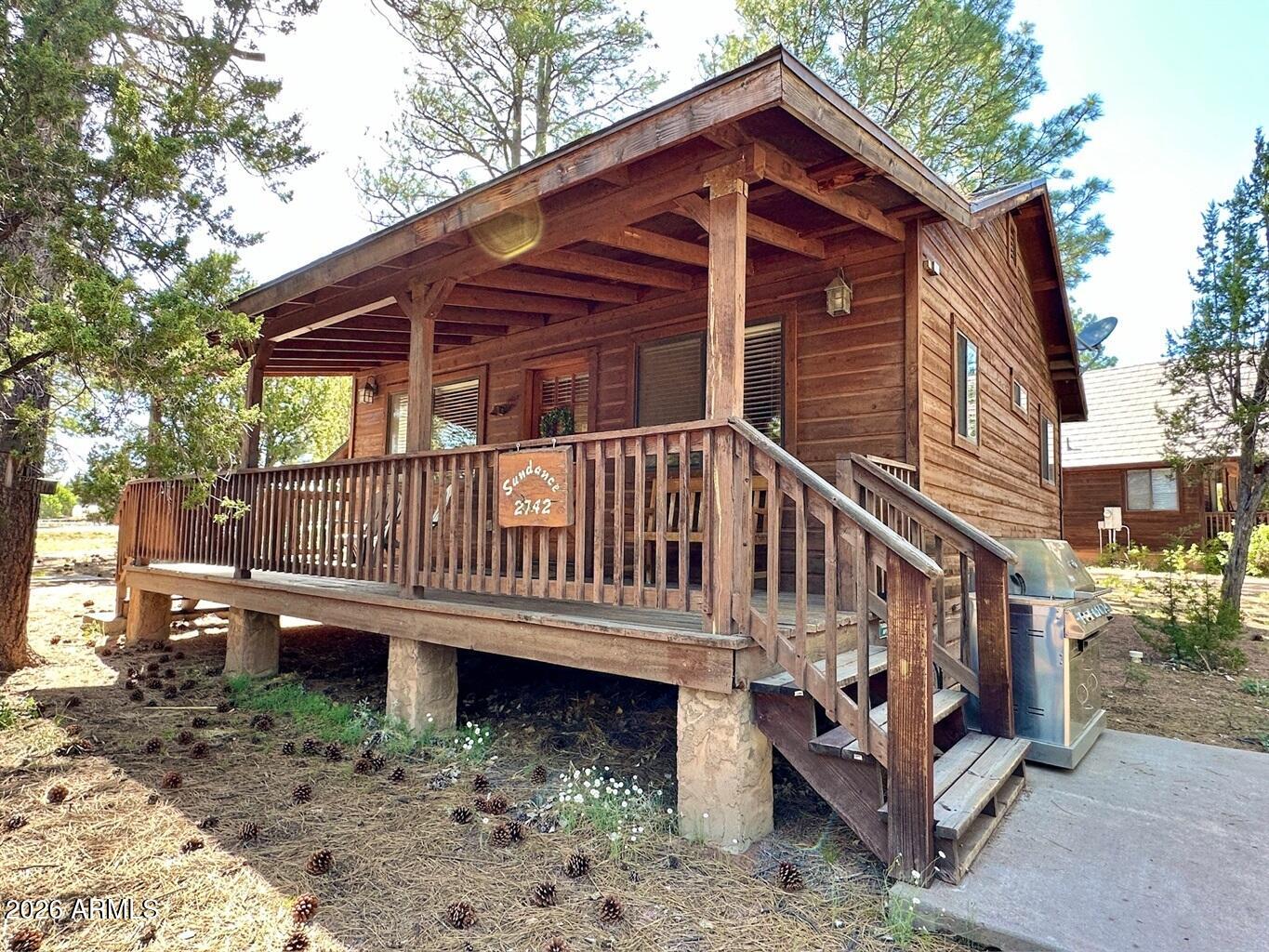 a view of a house with a yard deck and a yard