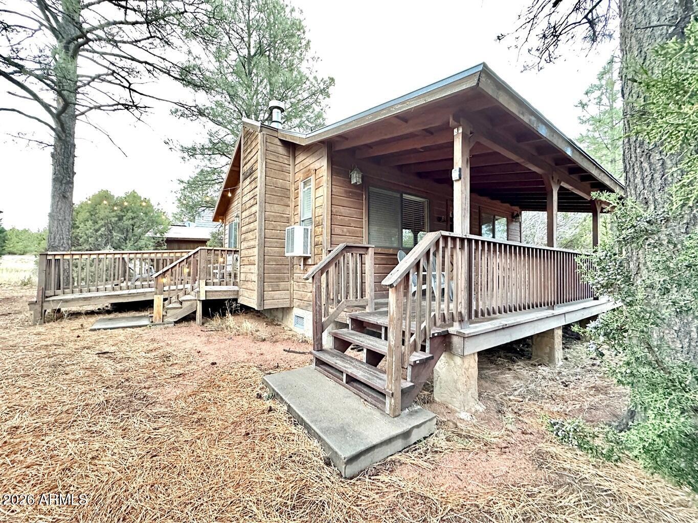 2742 Fox Trail Overgaard, AZ 85933 - Photo 19 of 19 a view of backyard with deck and seating space