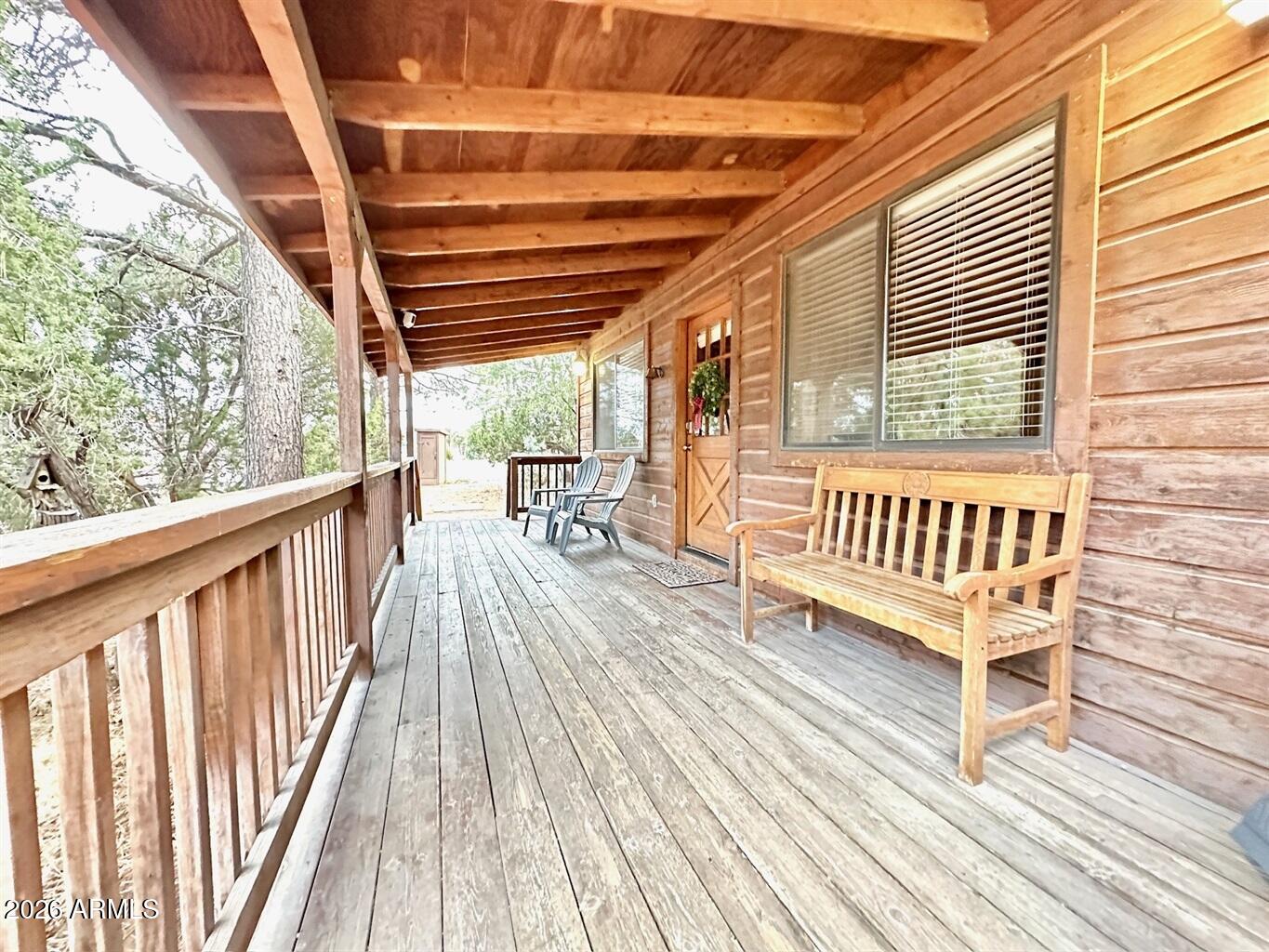 2742 Fox Trail Overgaard, AZ 85933 - Photo 2 of 19 a view of balcony with wooden floor and outdoor seating