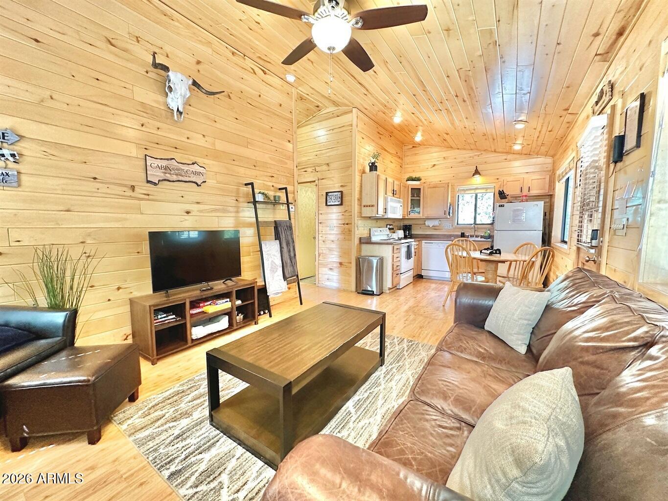 2742 Fox Trail Overgaard, AZ 85933 - Photo 6 of 19 a living room with furniture and a flat screen tv