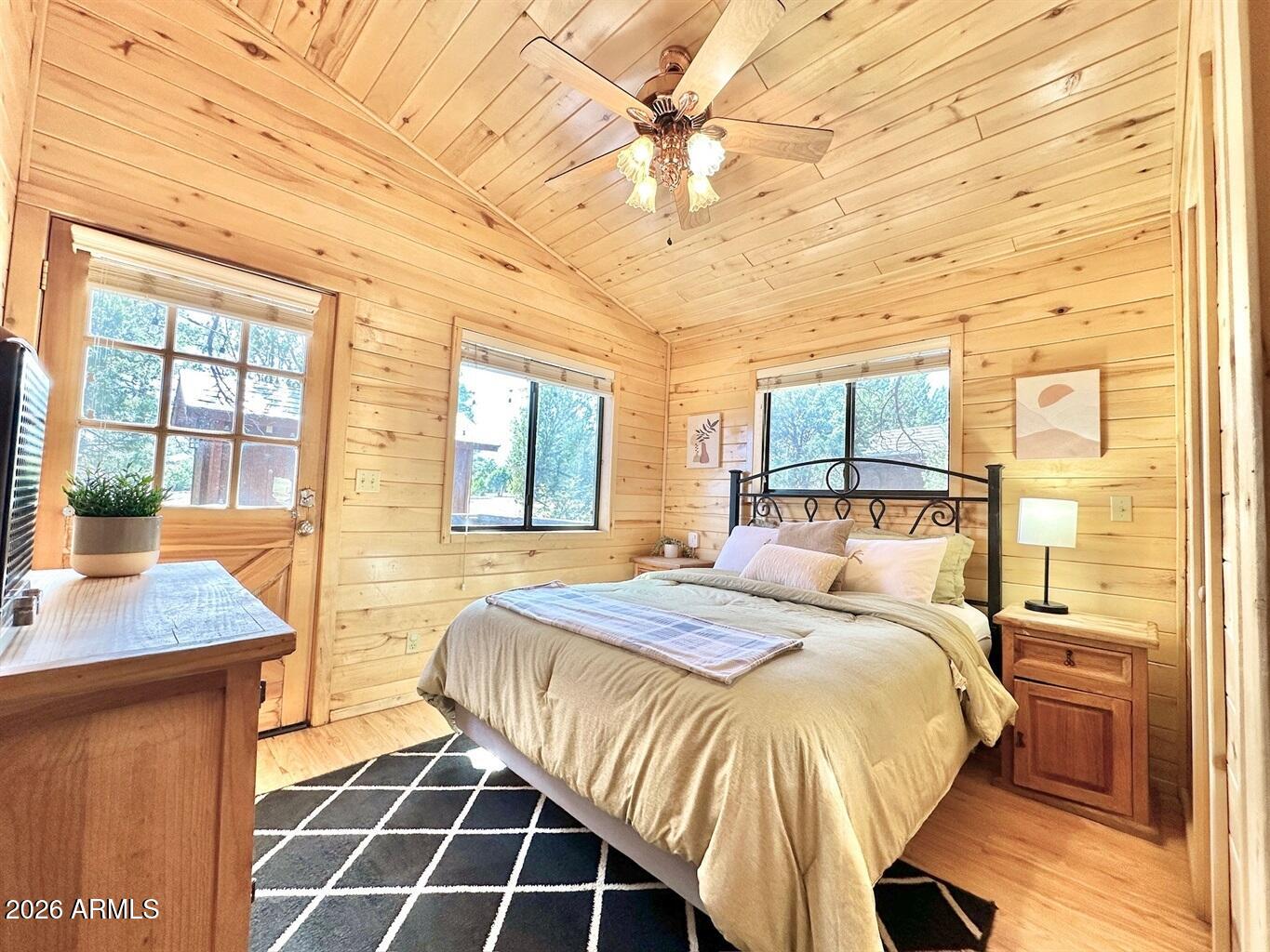 2742 Fox Trail Overgaard, AZ 85933 - Photo 7 of 19 a bedroom with a bed and a window