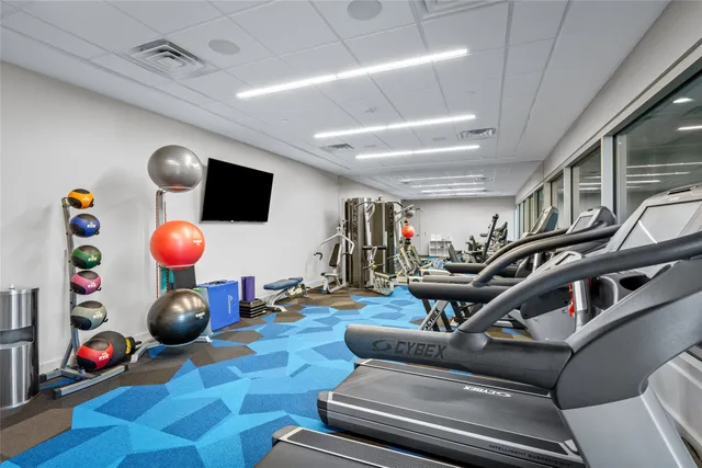 a room with lots of gym equipment