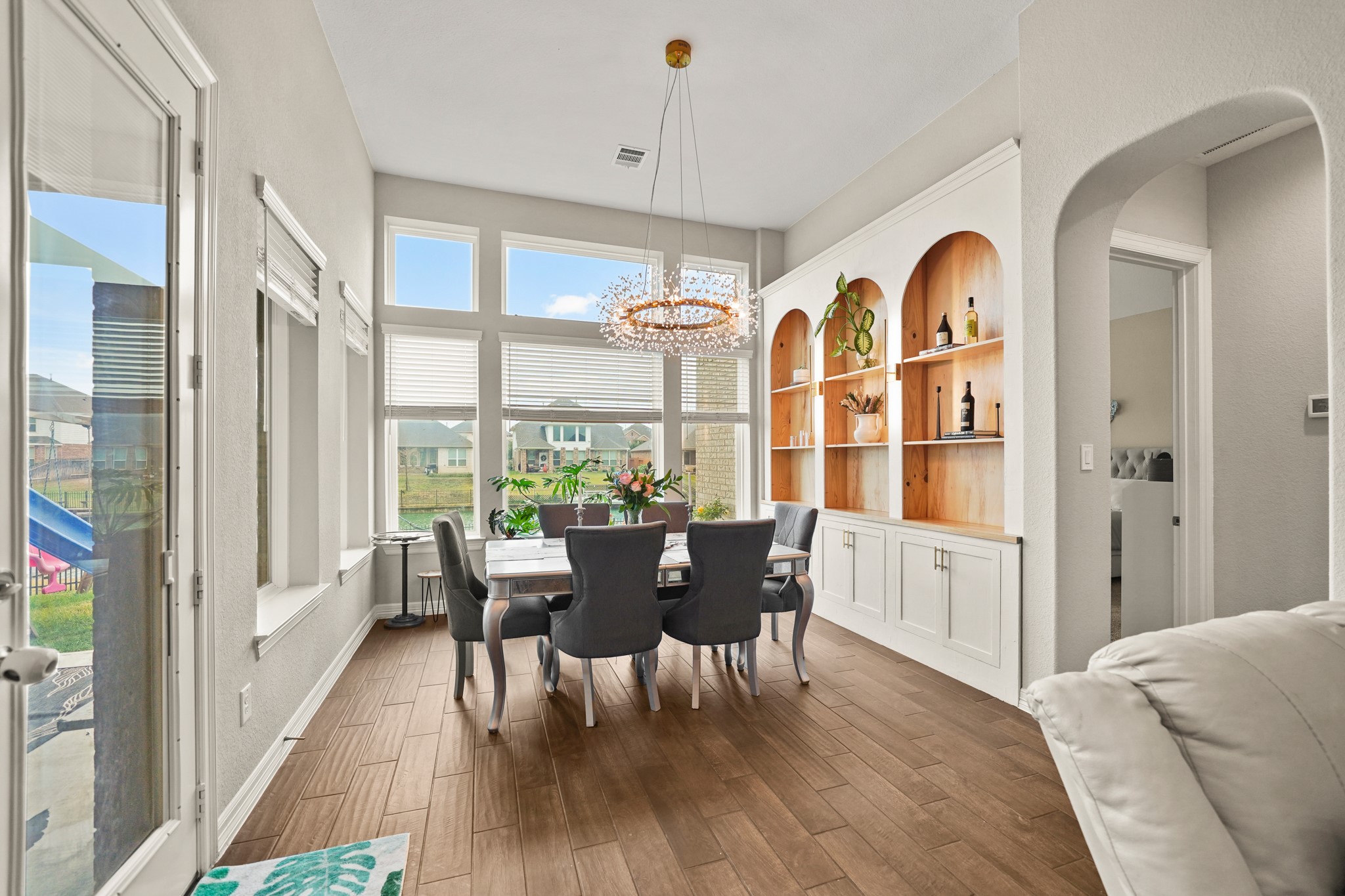 24031 Corinaldo Court Katy, TX 77493 - Photo 6 of 23 a view of a dining room with furniture window and wooden floor