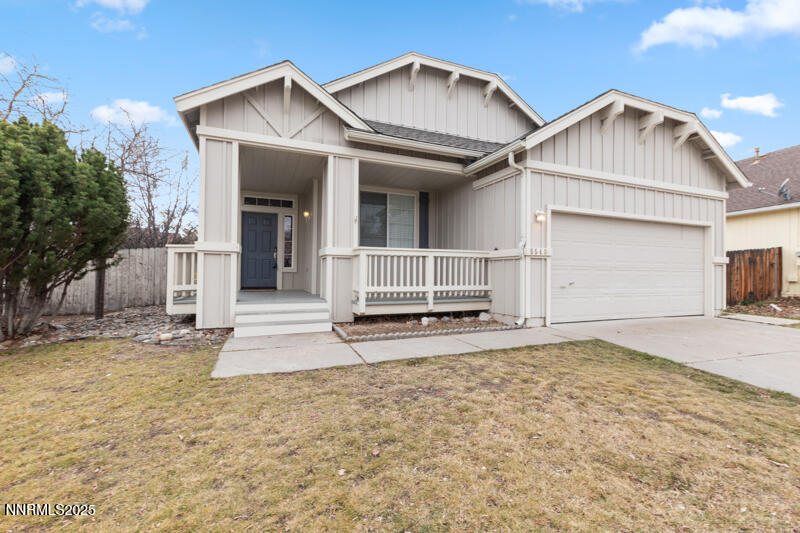 5540 Daybreak Drive Reno, NV 89523 - Photo 1 of 22 a front view of a house with a yard and garage
