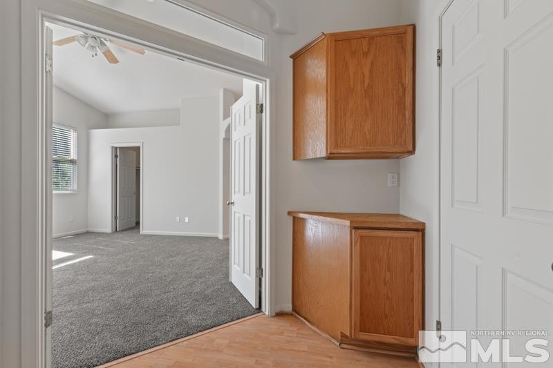 5540 Daybreak Drive Reno, NV 89523 - Photo 14 of 22 a view of hallway with wooden floor and cabinet