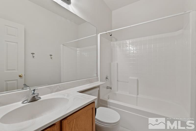 5540 Daybreak Drive Reno, NV 89523 - Photo 21 of 22 a bathroom with a sink a toilet and shower