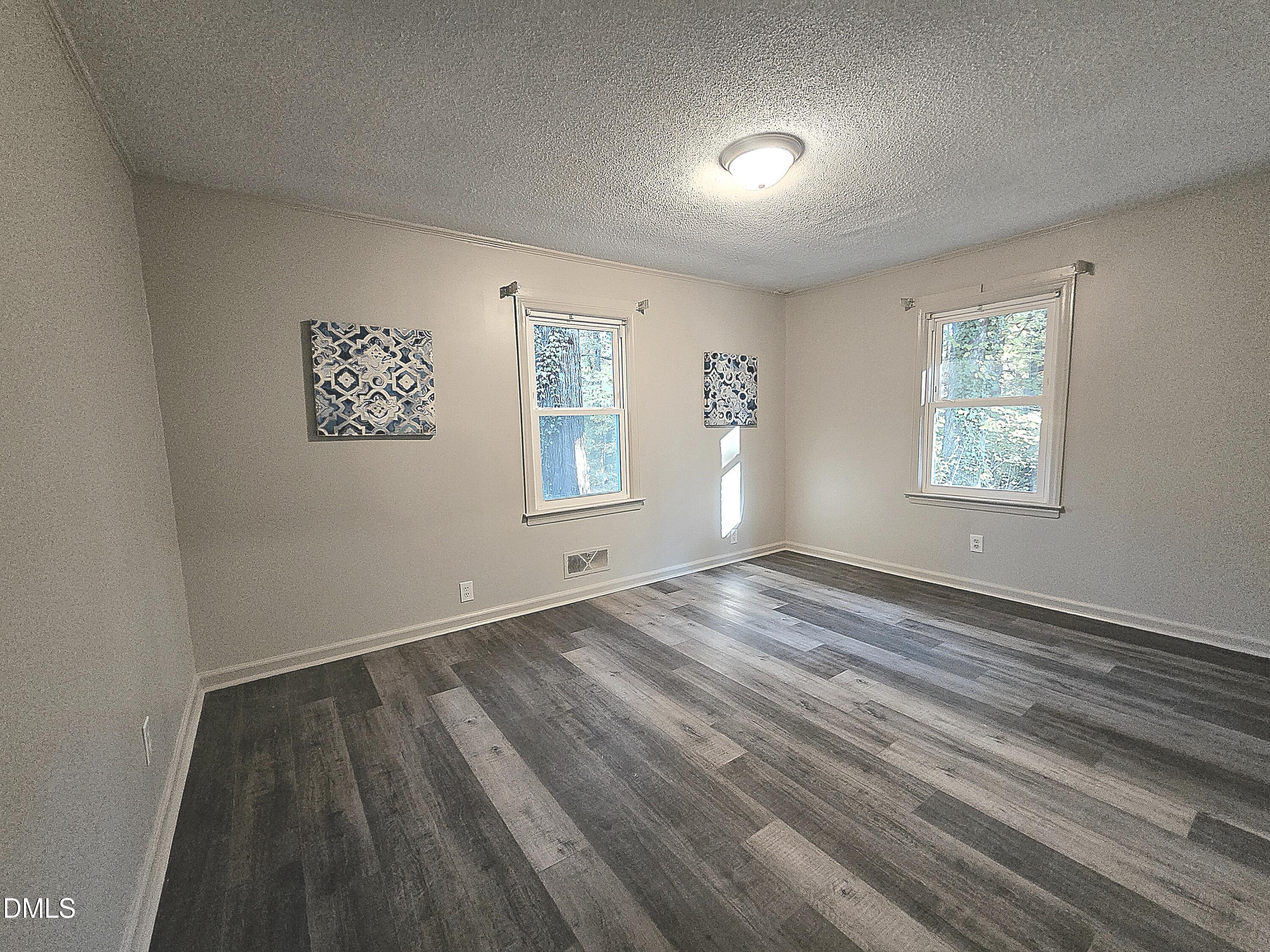 807 Grovemont Road Raleigh, NC 27603 - Photo 12 of 22 an empty room with windows