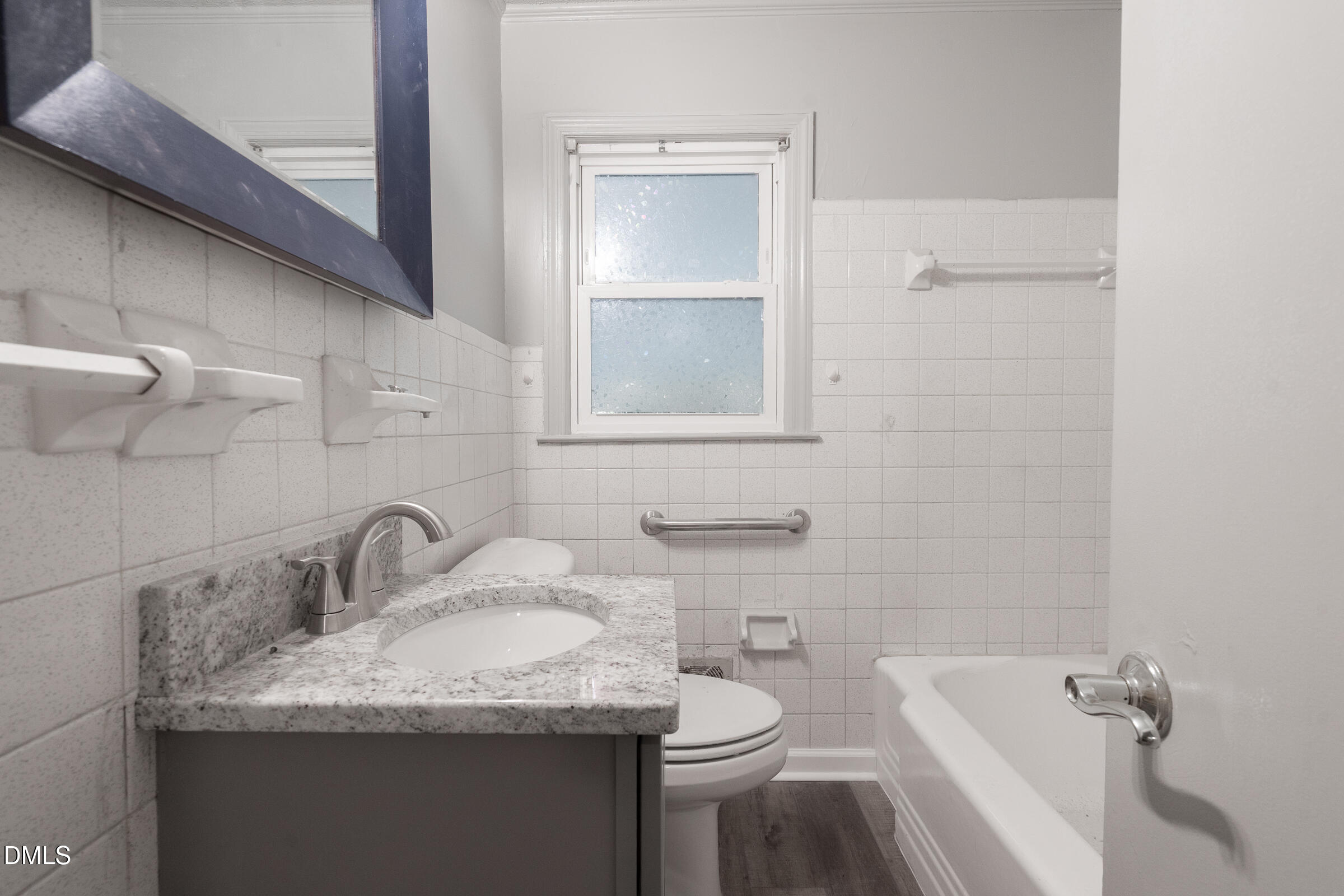 807 Grovemont Road Raleigh, NC 27603 - Photo 17 of 22 a bathroom with a granite countertop sink toilet and shower