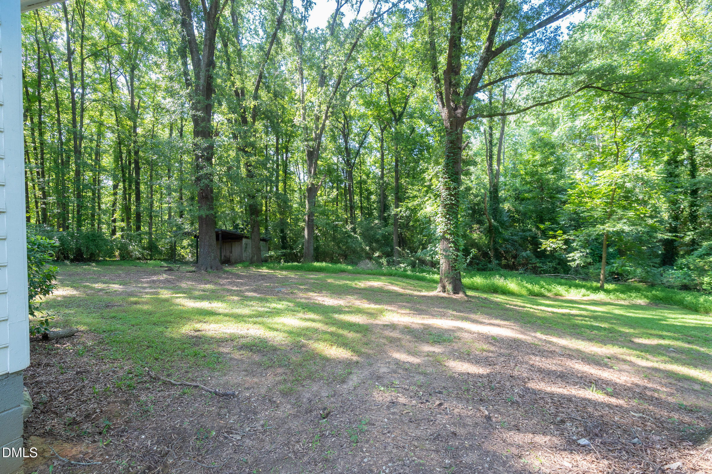 807 Grovemont Road Raleigh, NC 27603 - Photo 22 of 22 a view of a field with trees in the background