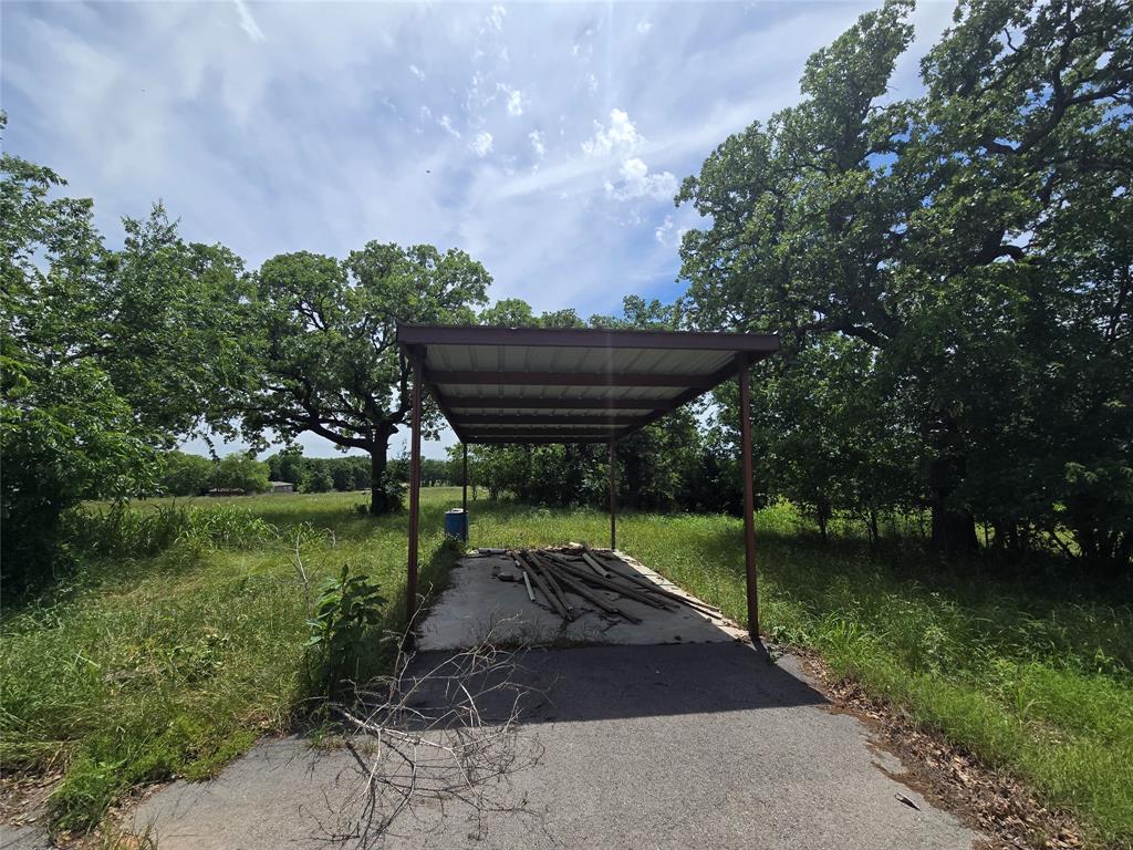 1331 Jay Bird Road Springtown, TX 76082 - Photo 15 of 18 a view of a backyard with a garden