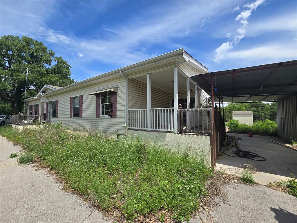 1331 Jay Bird Road Springtown, TX 76082 - Photo 2 of 18 front view of a house with a yard