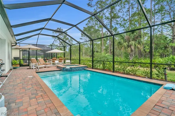 a view of swimming pool with a patio