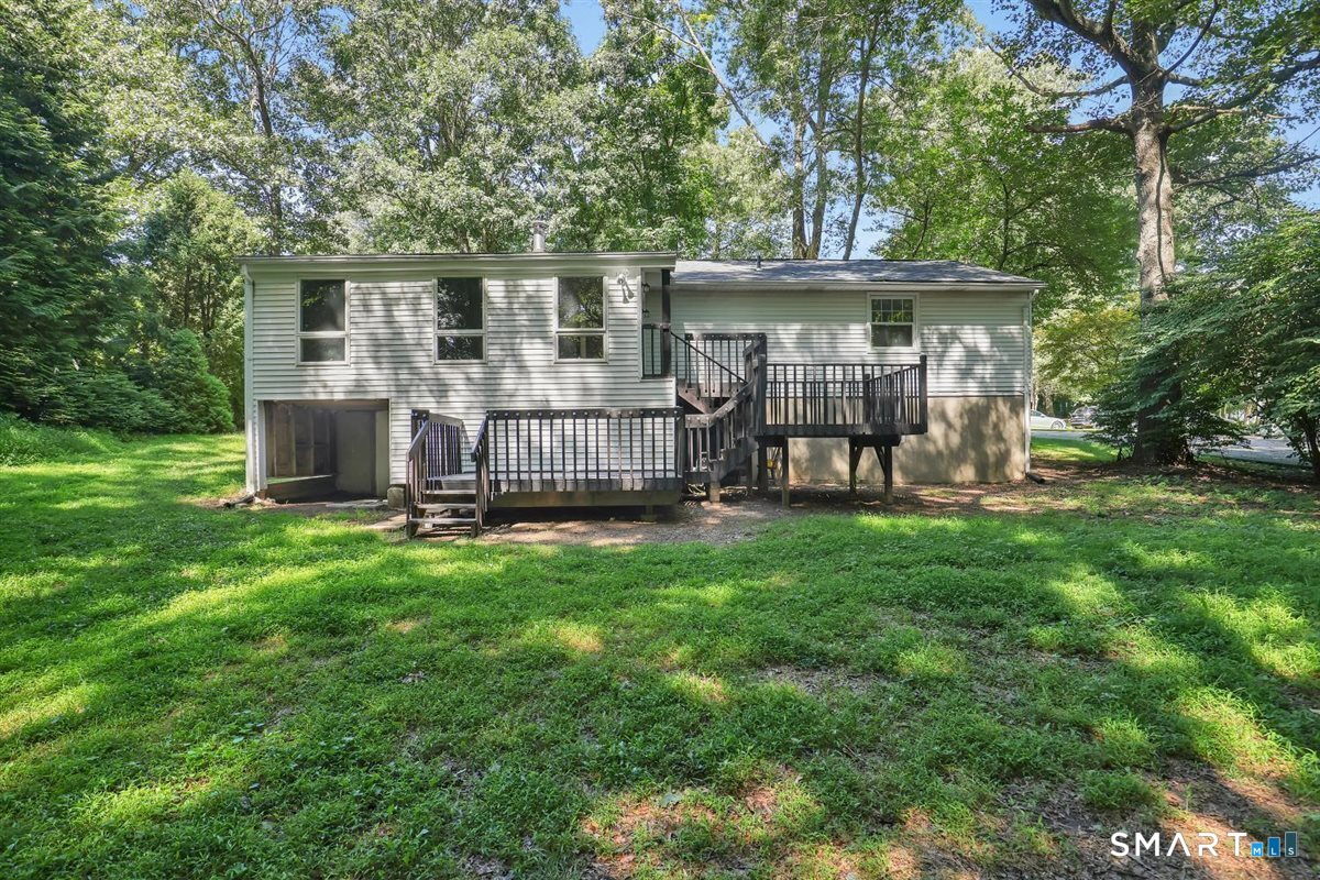 6 East Hayes Road East Hampton, CT 06424 - Photo 21 of 26 Rear view of home offering two spacious decks overlooking expansive park-like yard.