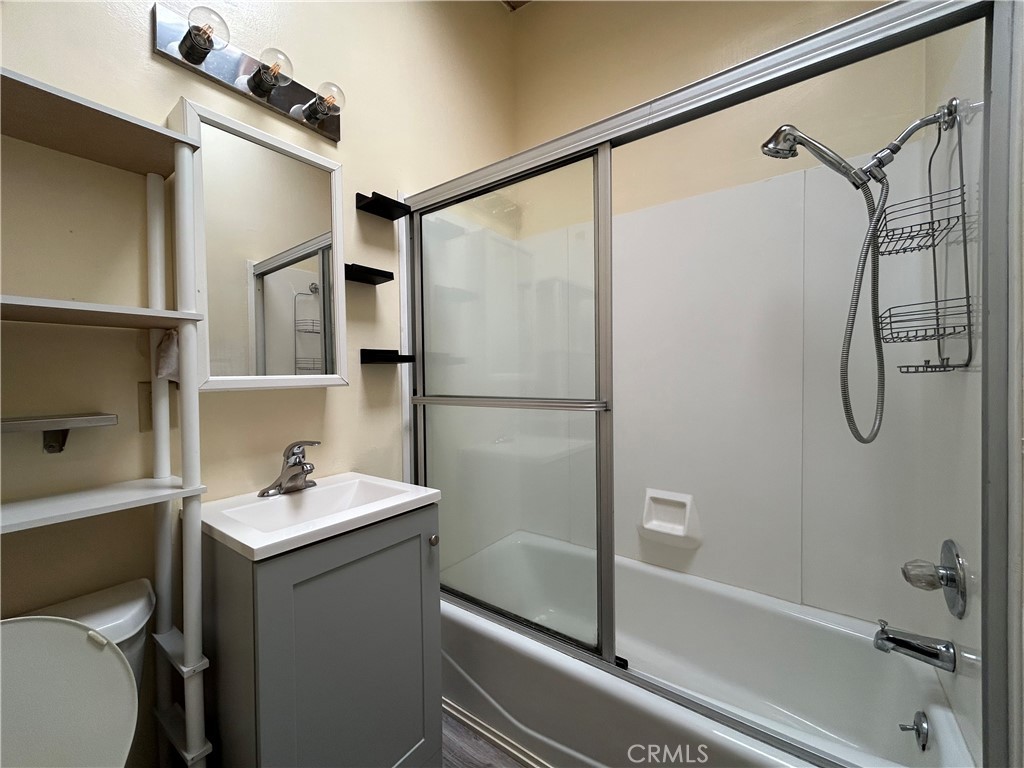 440 Atascadero Road, Unit 4 Morro Bay, CA 93442 - Photo 3 of 4 a bathroom with a sink mirror toilet and shower