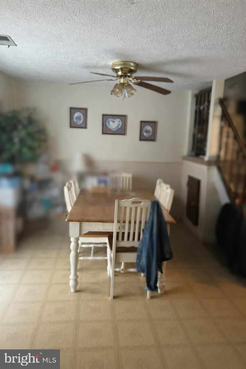 545 Beebe Court Frederick, MD 21703 - Photo 5 of 13 Dining Room-Tenants personal items are blurred.