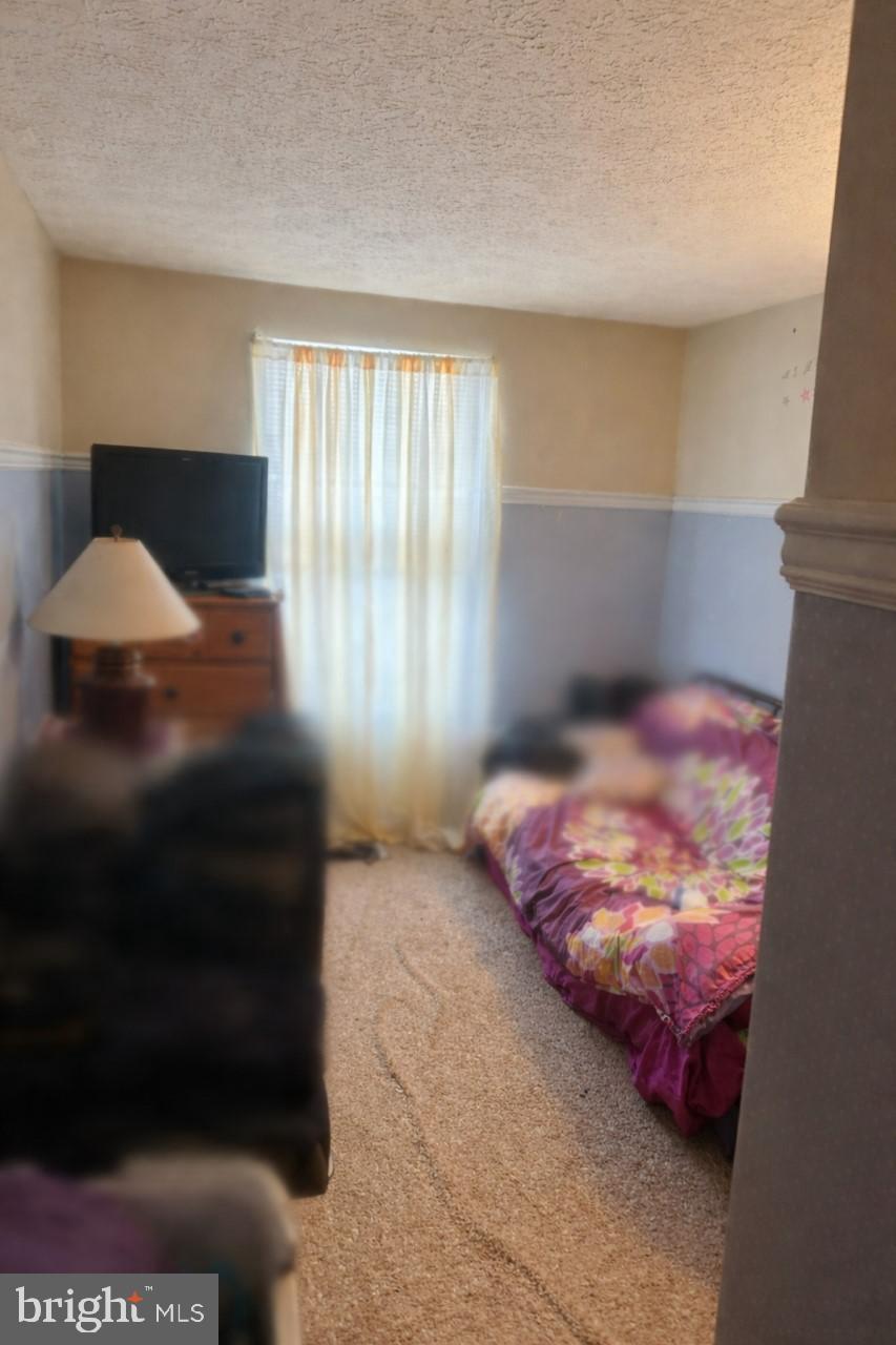 545 Beebe Court Frederick, MD 21703 - Photo 9 of 13 Second Bedroom-Tenants personal items are blurred.