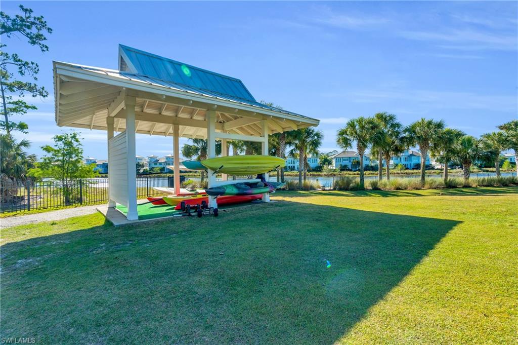 8937 Calypso Court Naples, FL 34113 - Photo 33 of 43 a view of yard with swimming pool and green space